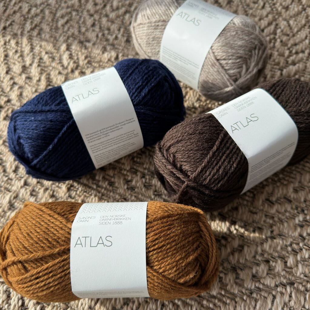 various balls of wool in autumnal colours