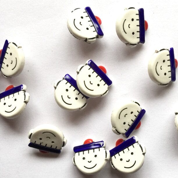 Set of decorative buttons with cartoonish design on a white background