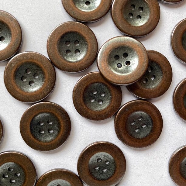 copper coloured metal button