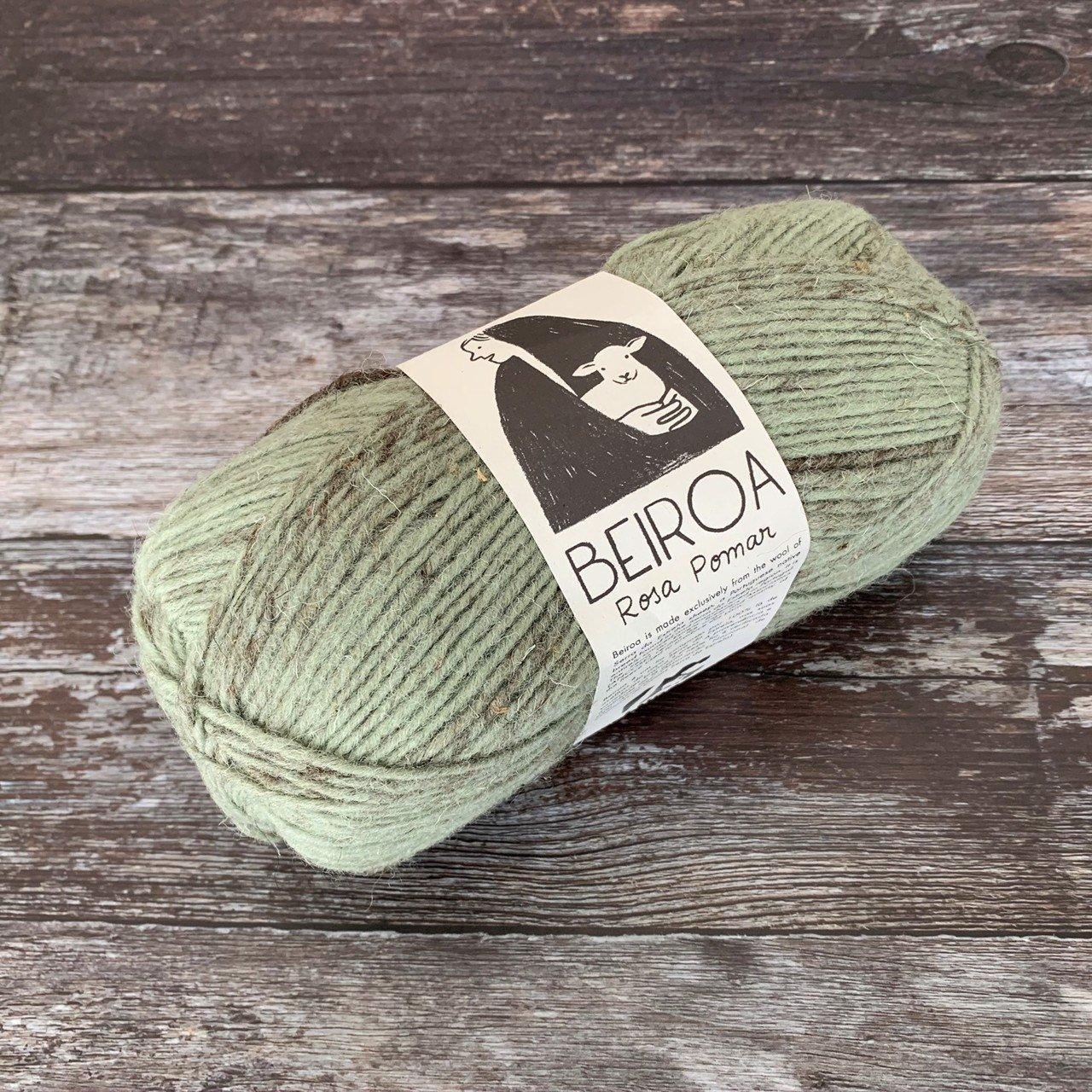 sage ball of yarn on wooden surface with label beiroa